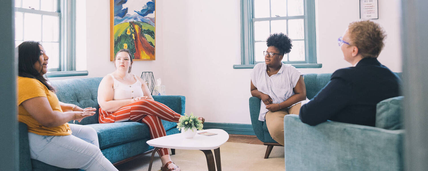 Group of people talking in open discussion