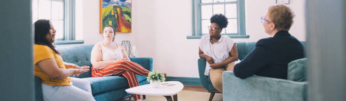 Group of people talking in open discussion