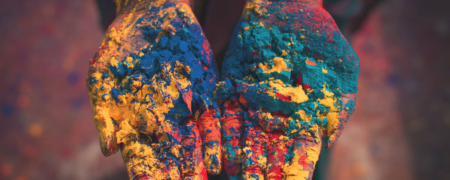 Student with powdered color in their hands