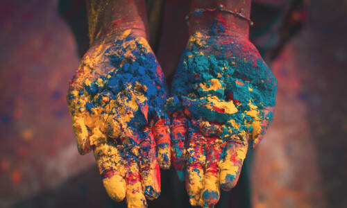 Student with powdered color in their hands