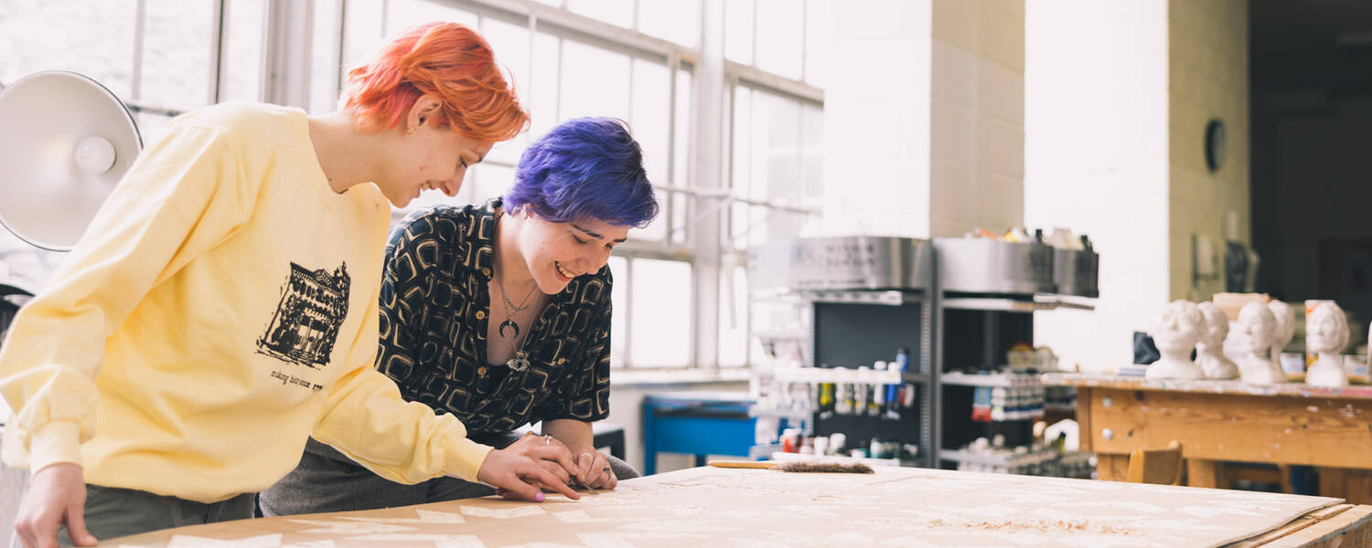 Two Salem College students in the fine arts room