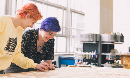 Two Salem College students in the fine arts room