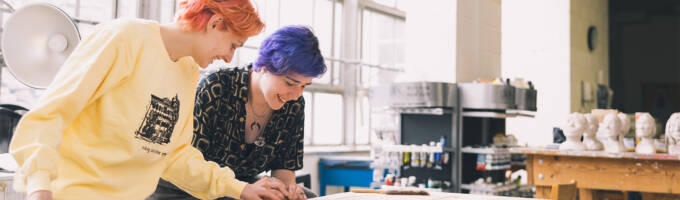 Two Salem College students in the fine arts room