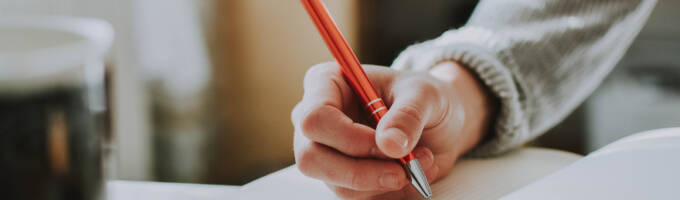 Person writing in a notebook