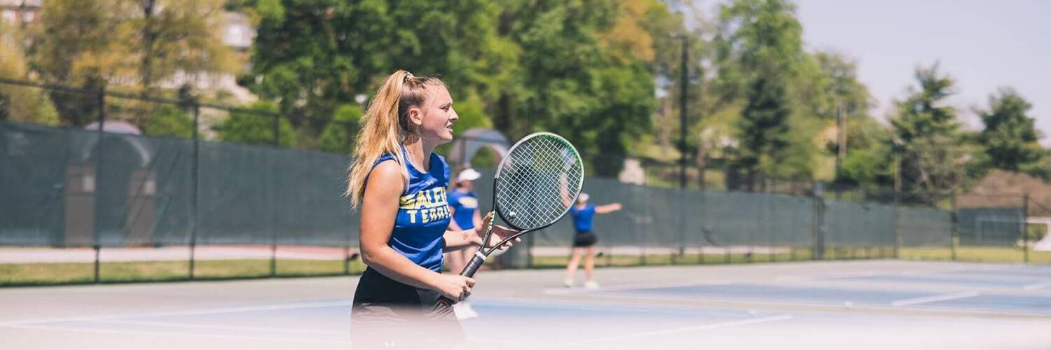 Salem College student playing tennis