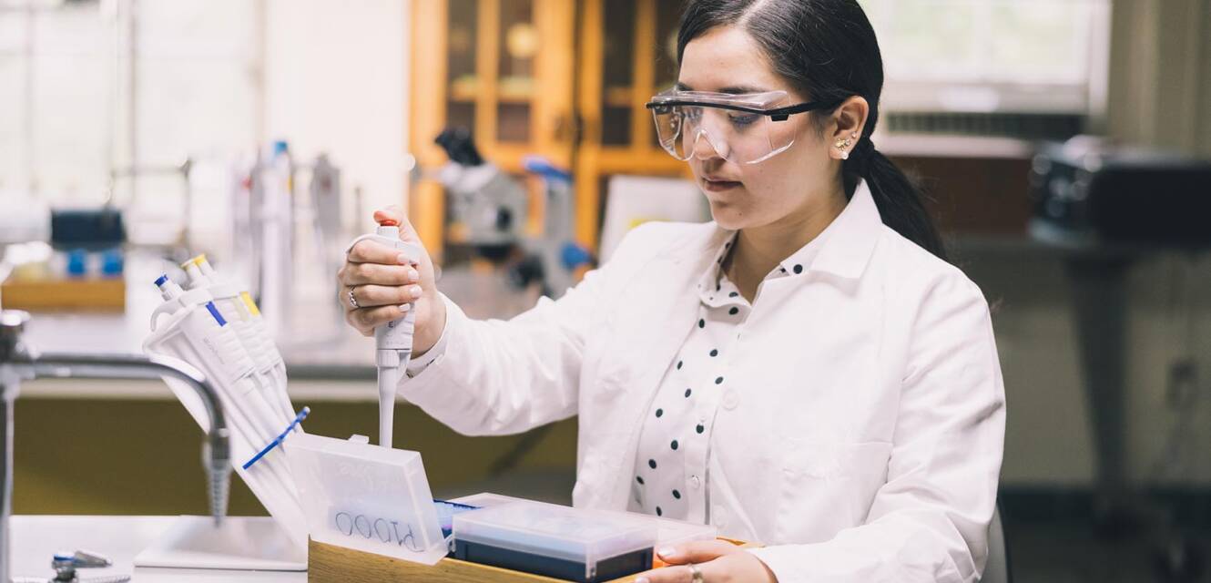 Salem College student working in a chemistry lab