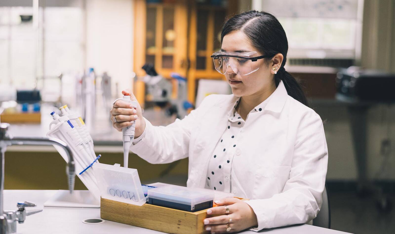 Salem College student working in a chemistry lab