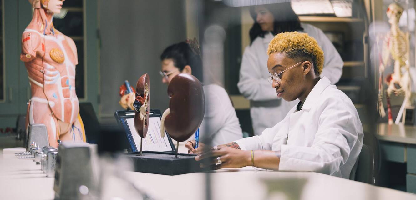 students working on science project in a lab