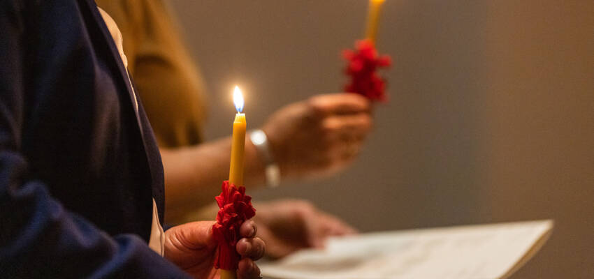 Salem College community members holding candles