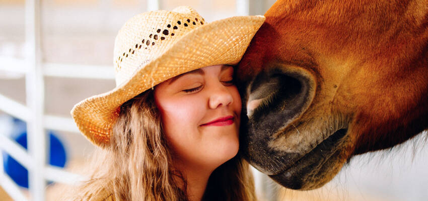 Salem College student with a horse