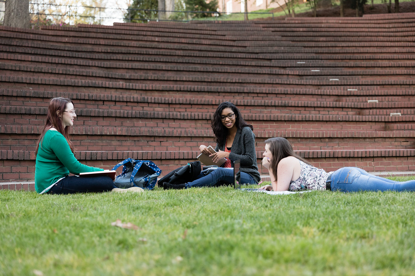 Students relaxing in the May Dell on the campus of Salem College