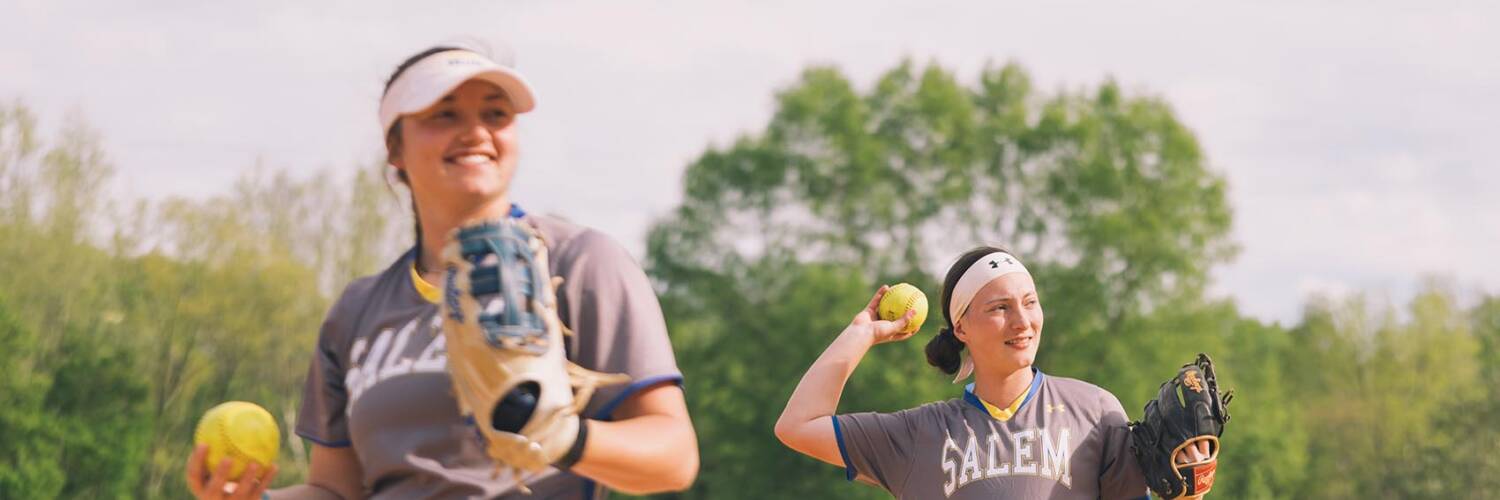 Two Salem College students warming up at softball practice