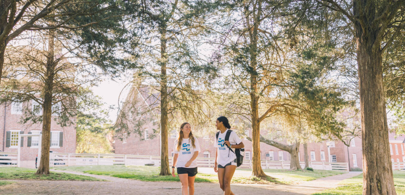 Salem College Soccer players walking down campus path