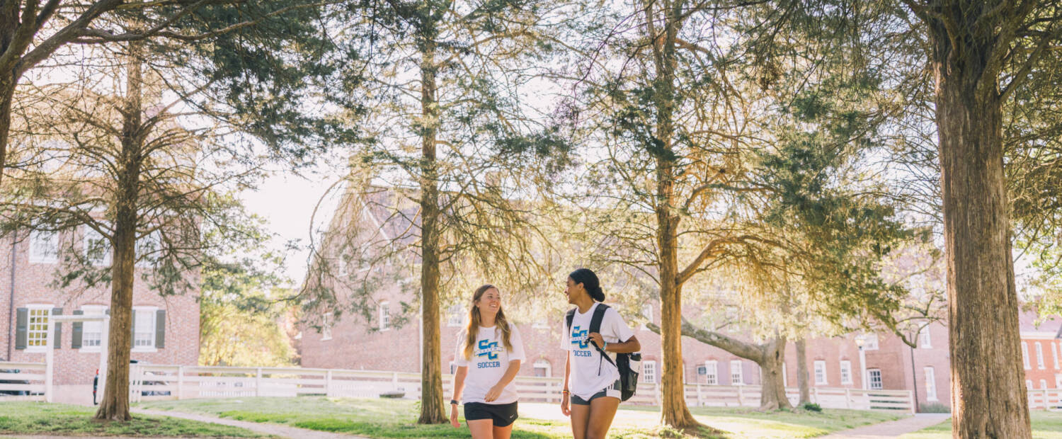 Salem College Soccer players walking down campus path