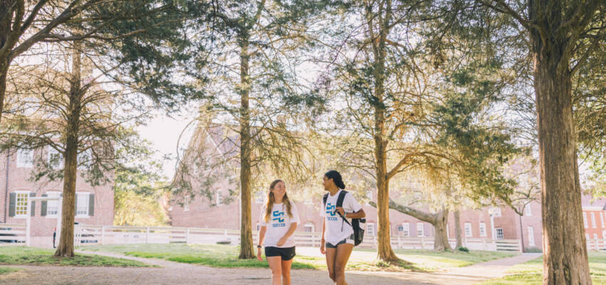 Salem College Soccer players walking down campus path