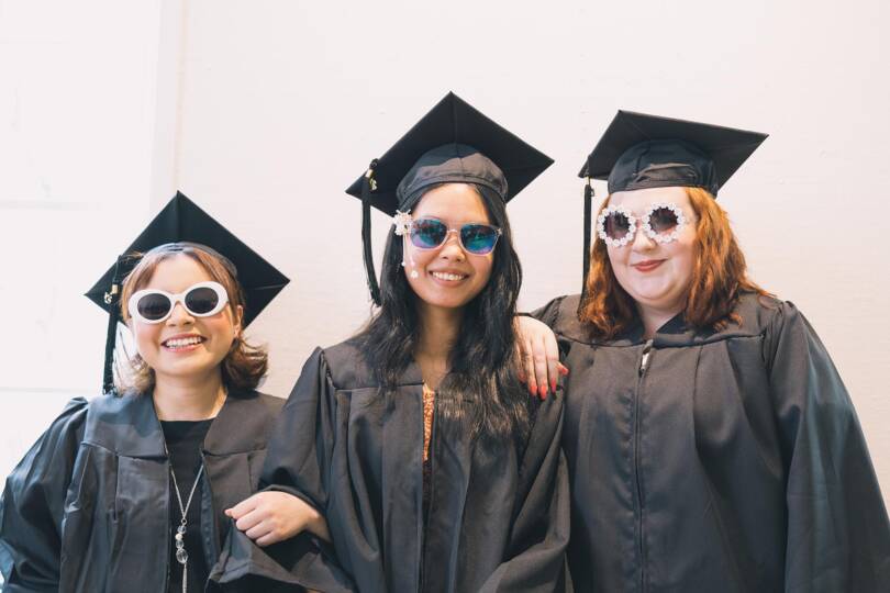 Students wearing sunglasses at graduation