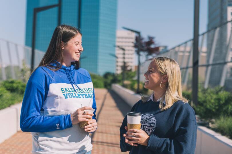 Salem College athlete and staff member in downtown Winston Salem