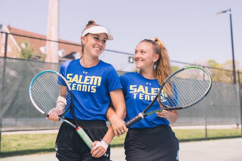 Salem College student tennis athletes posing with their racquets