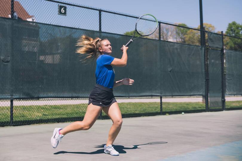 Salem College student playing tennis